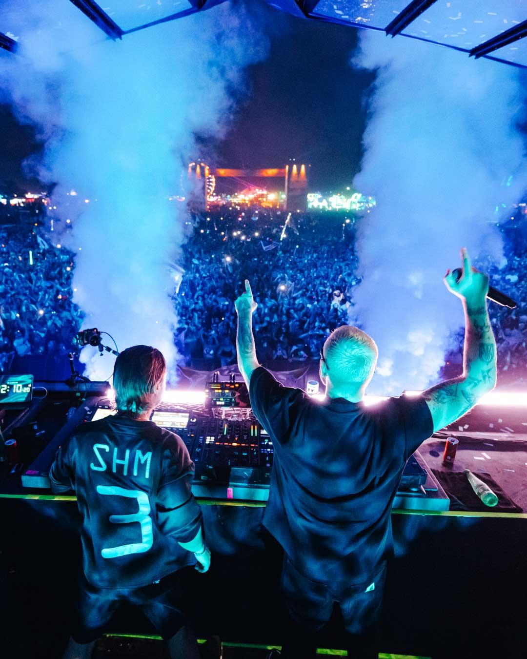 Headline DJs facing the crowd from the main stage at EDC Thailand