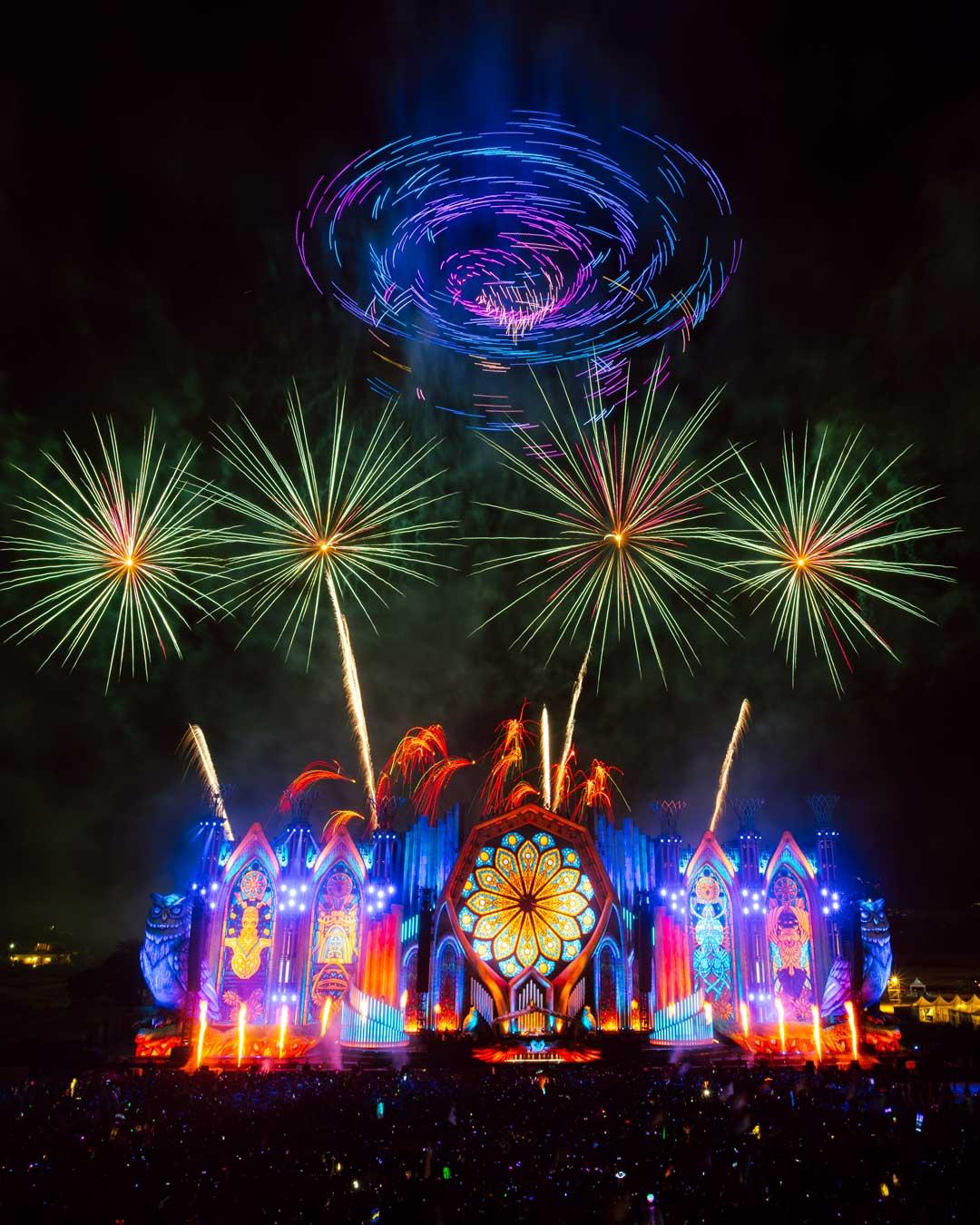 kineticFIELD main stage lit up at night under fireworks at EDC Thailand